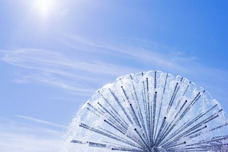 Fountain, sky and sun. Summer holiday conceptの写真素材