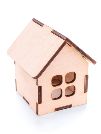 Small wooden toy house close up. Isolated on white, clipping path includedの写真素材