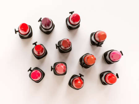 Group of small lipsticks set. Top view on white backgroundの写真素材