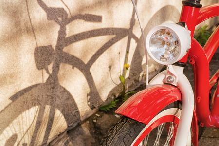 Bicycle and its shadow. Warm toned image