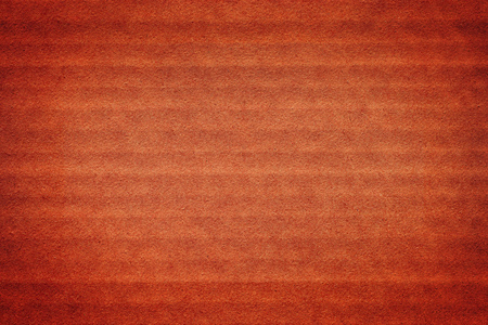 Red cardboard close up. Grunge texture and backgroundの写真素材