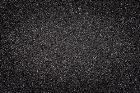 Black sand. Texture and background, light center for copy spaceの写真素材
