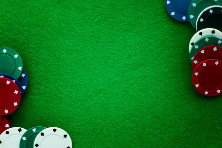 Green felt and playing chips abstract background. Poker, casino and gambling themeの写真素材