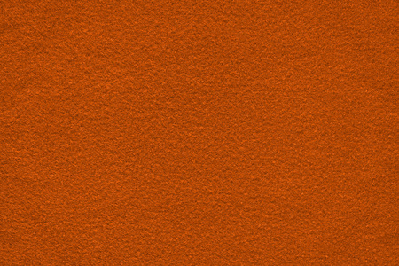 Dark orange (bronze) felt surface close up. Texture and backgroundの写真素材