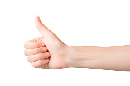 Woman hand showing thumb up gesture. Isolated on white, clipping path includedの写真素材