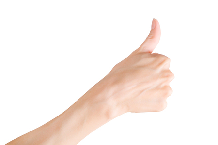 Woman hand showing thumb up gesture. Isolated on white, clipping path includedの写真素材