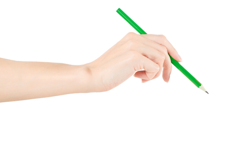 Woman hand holding green pen. Isolated on white, clipping path includedの写真素材