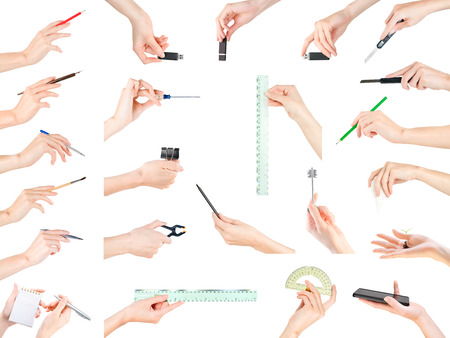 Woman hands with different small items large set. Office, stationery, writing and education theme. Isolated on white, clipping path includedの写真素材