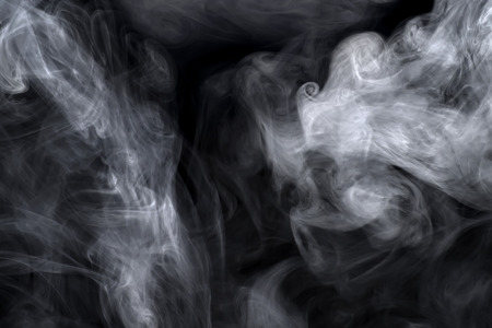 White smoke on black. Texture and backgroundの写真素材