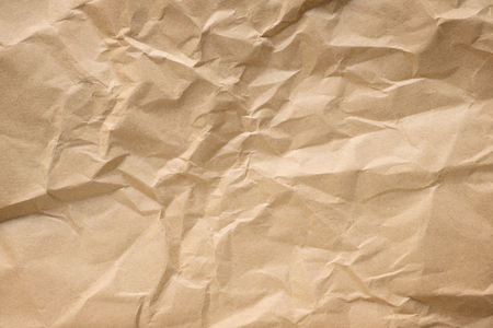 Crumpled craft paper close up. Texture and backgroundの写真素材