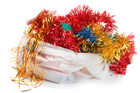 Christmas decorations in white plastic bag. Isolated on whiteの写真素材