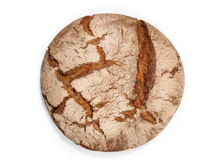 Round freshly baked rustic rye round bread. Top view isolated on whiteの写真素材