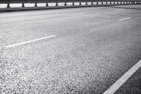 Asphalt on wide highway. Black and white image, selective focusの写真素材