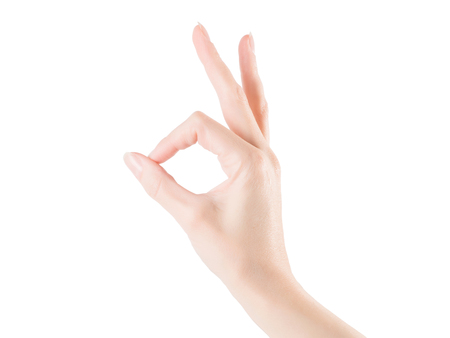 Woman hand showing okay or zero gesture. Isolated on white, clipping path includedの写真素材