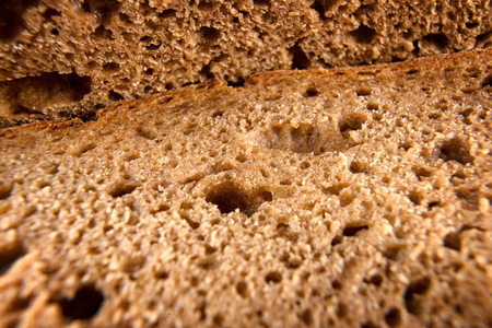Fresh bread extreme close up. Macro textured view of bread slices