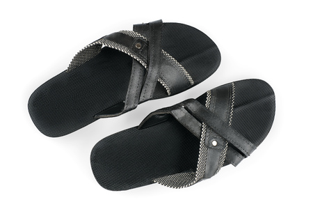 Pair of male black slippers top view. Isolated on white, clipping path includedの写真素材