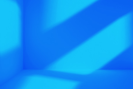 Empty corner of blue room with deep windows shadow. Minimalistic space conceptの写真素材