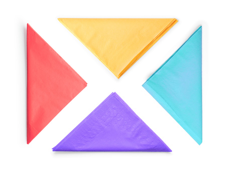Colored paper napkins folded as triangle set. Isolated on white, clipping path included