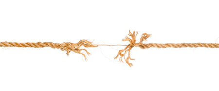Long frayed rope near to break. Isolated on whiteの写真素材