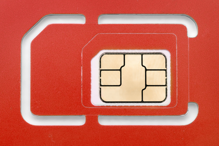 New blank red phone sim card close up. Macro imageの写真素材