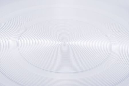 Abstract round metallic texture close up. Angle view with selective focusの写真素材