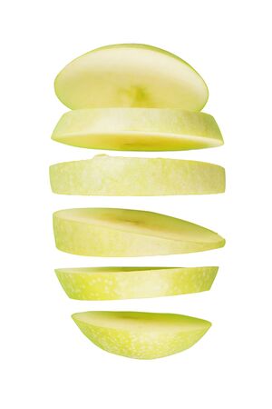 Sliced green apple flying. Isolated on whiteの写真素材