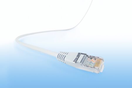 Network cable wide angle view with selective focus. Isolated on abstract blue background, clipping...