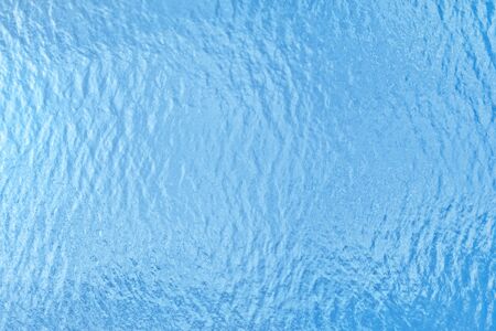 Blue sea surface top view. Water texture and background