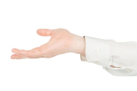 Man hands in white shirt holding something. Isolated on white, clipping path includedの写真素材
