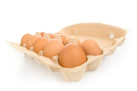 Pack of large brown hen eggs with cardboard box wide angle view isolated on white