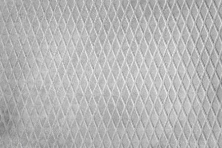 Rough gray concrete slab with diamond pattern close up. Industrial texture and backgroundの写真素材
