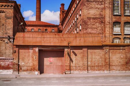 Old brick prison closed gates. Old building of "Kresty" (Crosses) detention center in Saint Petersburg, Russia. の写真素材