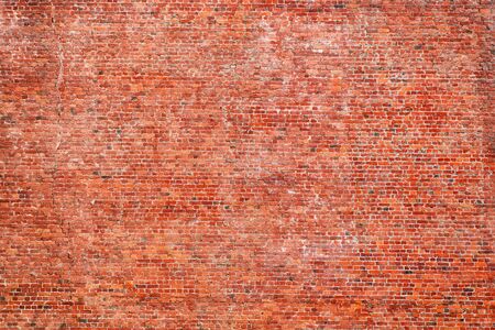 Large red rough brick wall. Texture and backgroundの写真素材
