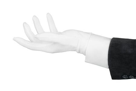 Close up of open man hand in black suit and white glove holding, supporting or offering something. Isolated on white backgroundの写真素材