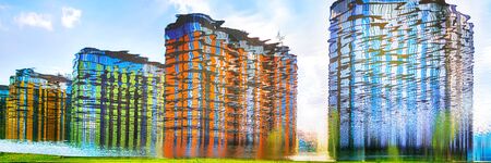 Bright colored residential buildings. Blurred reflection in the water