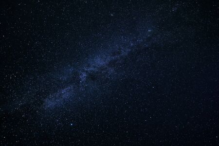 Starry night. Milky way at deep black skyの写真素材