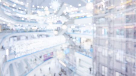 Blurred defocused background in mall with with stairs, tiered and glass elevator shaftの写真素材