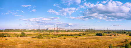 Industrial landscape with fields, industrial zone and high voltage power line. HDR panoramic view