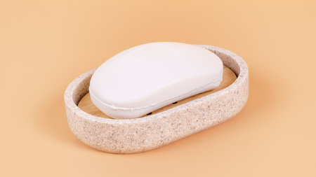 Soap in a soap dish close up. Side view isolated on beige, clipping path includedの写真素材