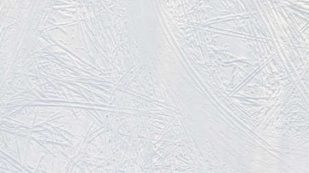 Snow-covered ice with ski tracks large top aerial view. Natural texture and backgroundの写真素材