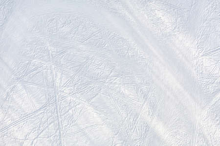 Snow-covered ice with ski tracks top aerial view. Natural texture and backgroundの写真素材