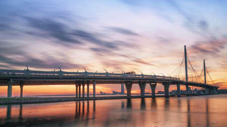 Elevated high speed road against bright colored sunset. Saint Petersburg, Russiaの写真素材