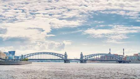 Neva river in Saint Petersburg panoramic view with Bolsheokhtinsky bridge. Industrial landscapeの写真素材