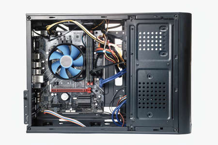 Black open desktop computer side view with motherboard visible. PC isolated on white,