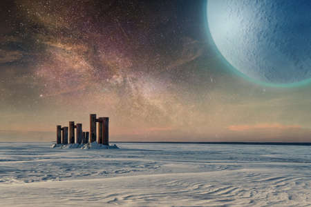 Fantastic landscape with a frozen icy surface, a starry sky and a distant planet above it. Abstract science fiction and space exploration theme imageの写真素材