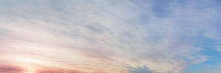 Large dramatic overcast at sunset. Wide angle view of evening skyの写真素材