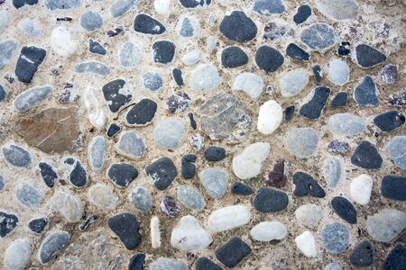 Background of stone wall texture photo. Wallpaper.の写真素材
