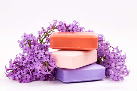 Natural handmade soap and lilac flowers on white backgroundの写真素材