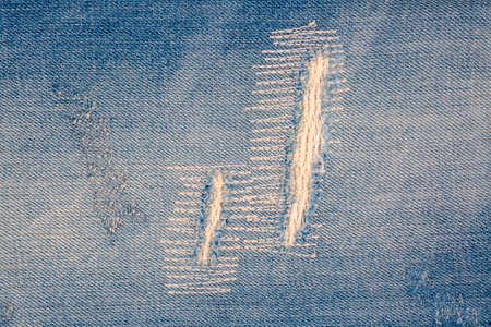 Closeup of blank jeans patch on inner side of worn blue denim