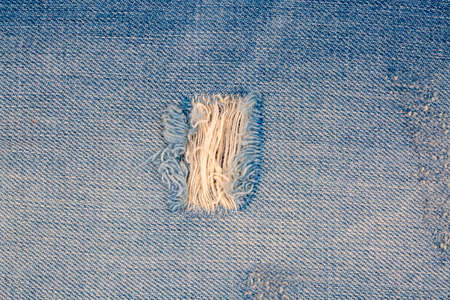 Closeup of blank jeans patch on inner side of worn blue denim